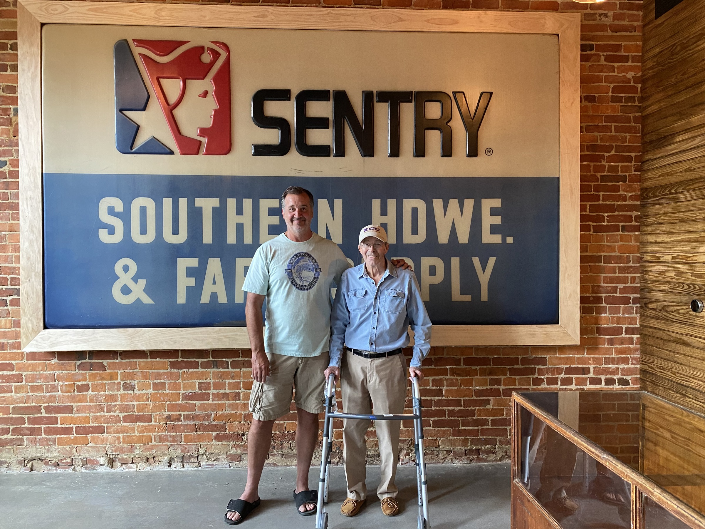 Matt and Ted with the preserved Southern Hardware sign